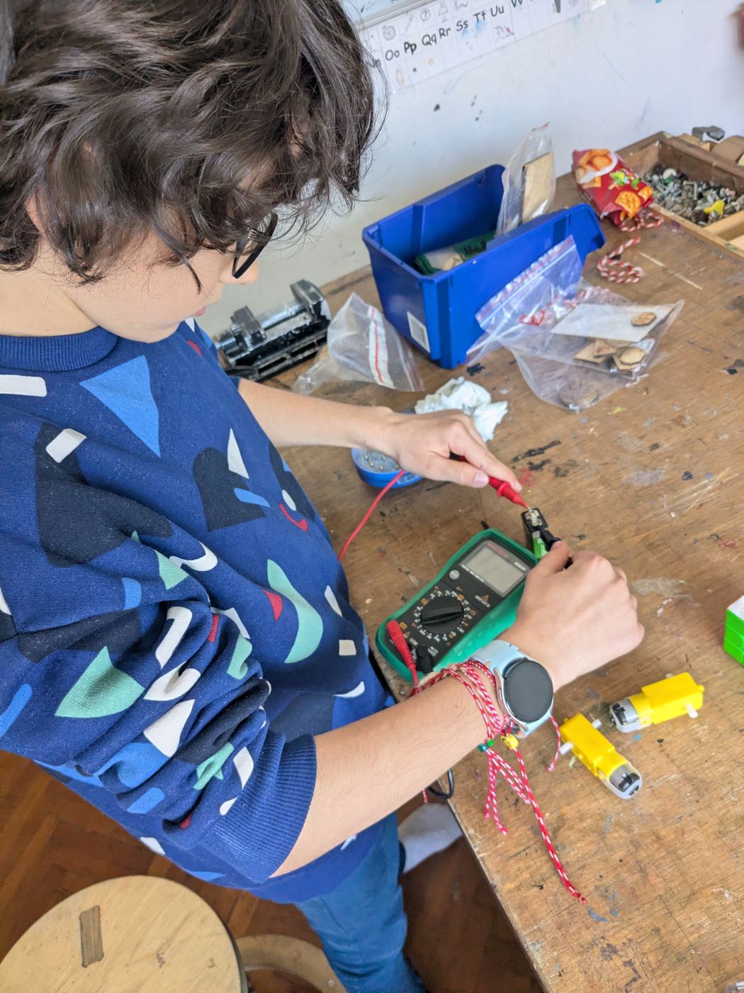 A child actively building, inventing, or participating in the TwoFish environment.