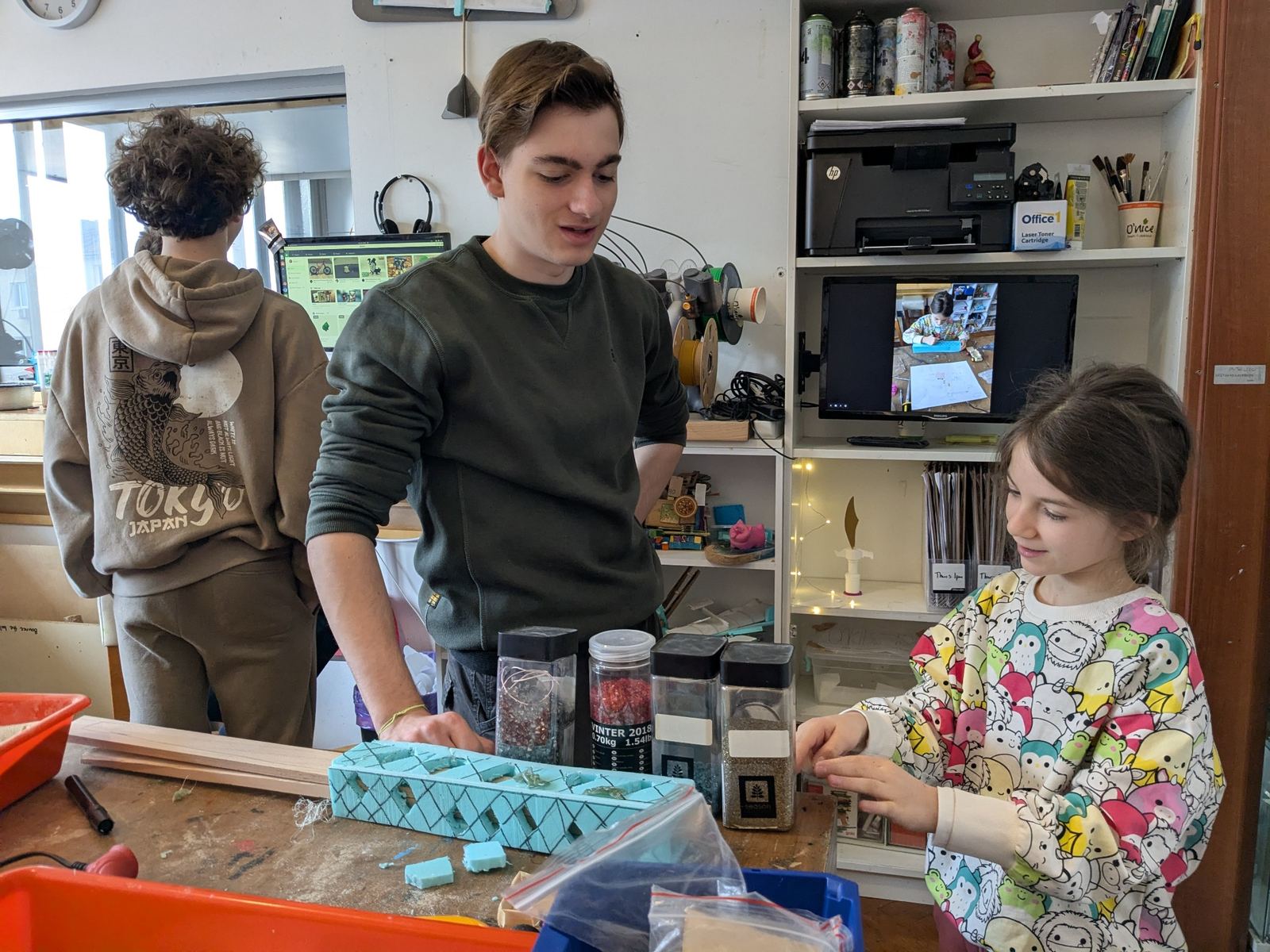 An older leader and a child working together in a calm, supported TwoFish moment.