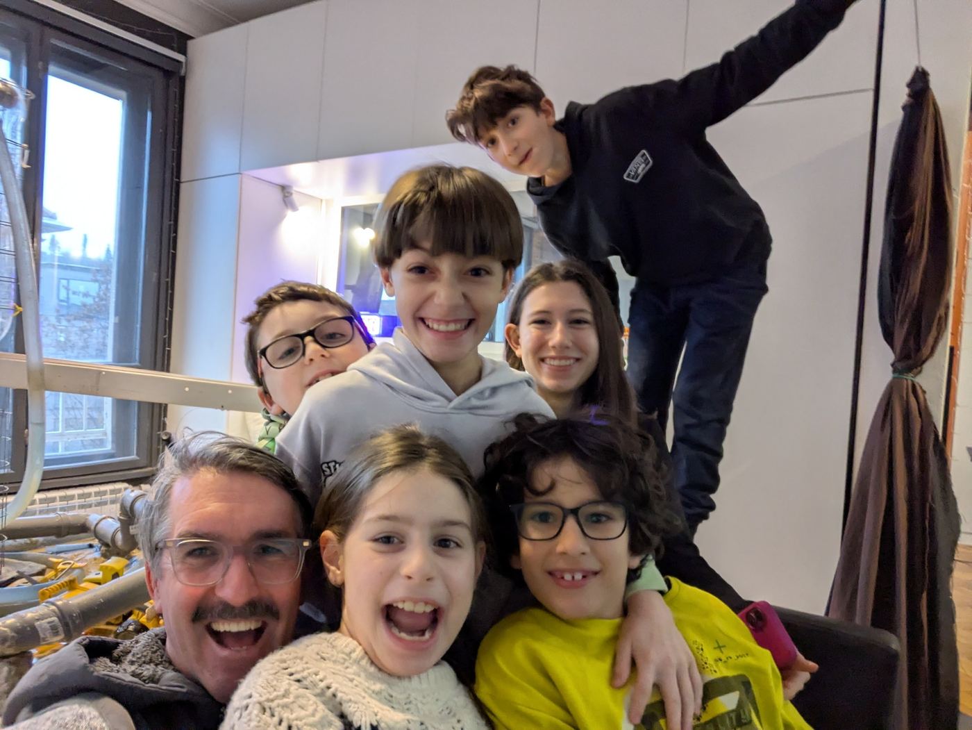 Children gathered in conversation and leadership inside the TwoFish environment.