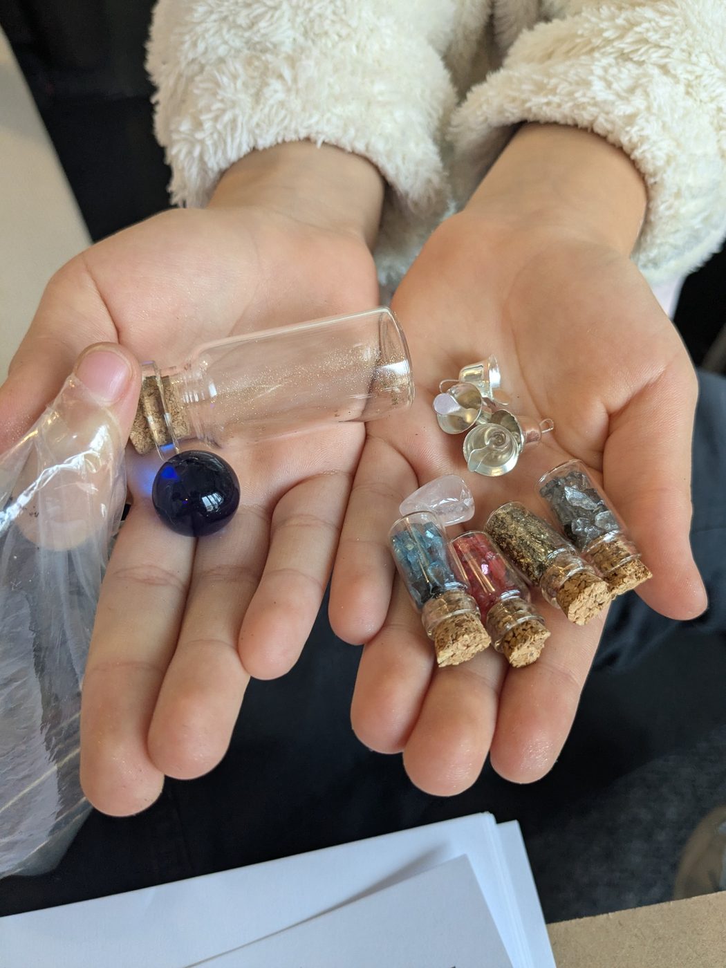 Small handmade creations displayed in a child's hands.